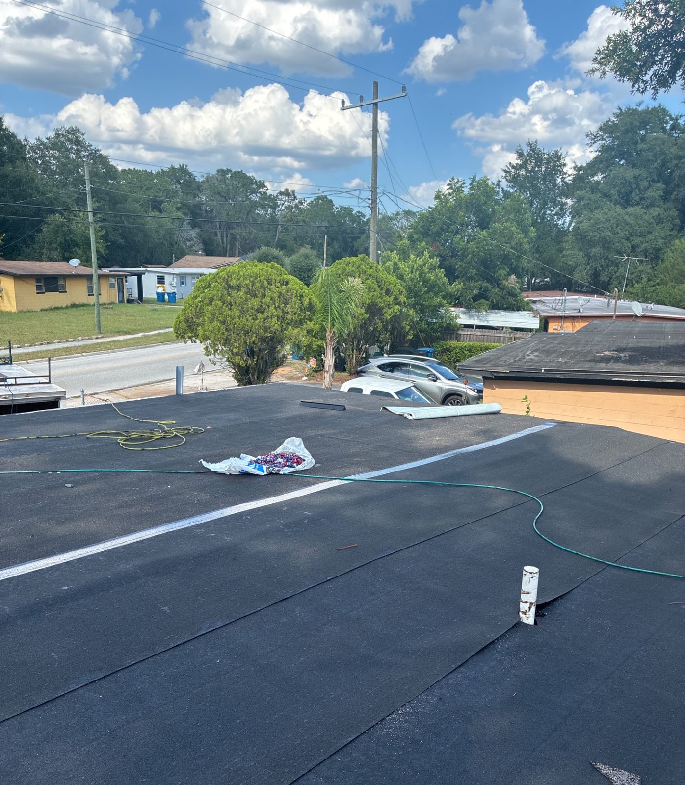 Commercial building flat roof re-roof in progress