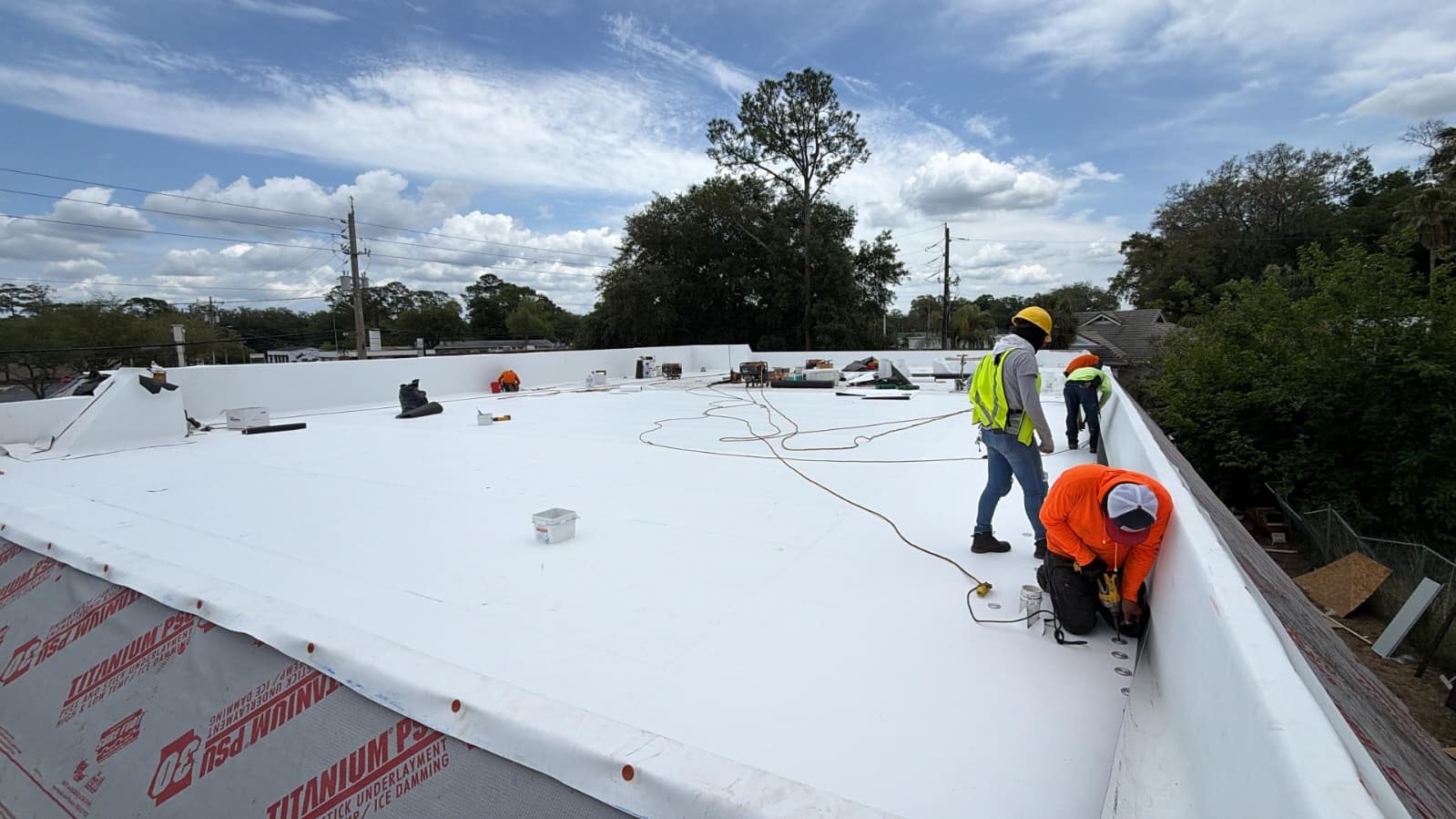 Commercial building single-ply membrane re-roof with crew