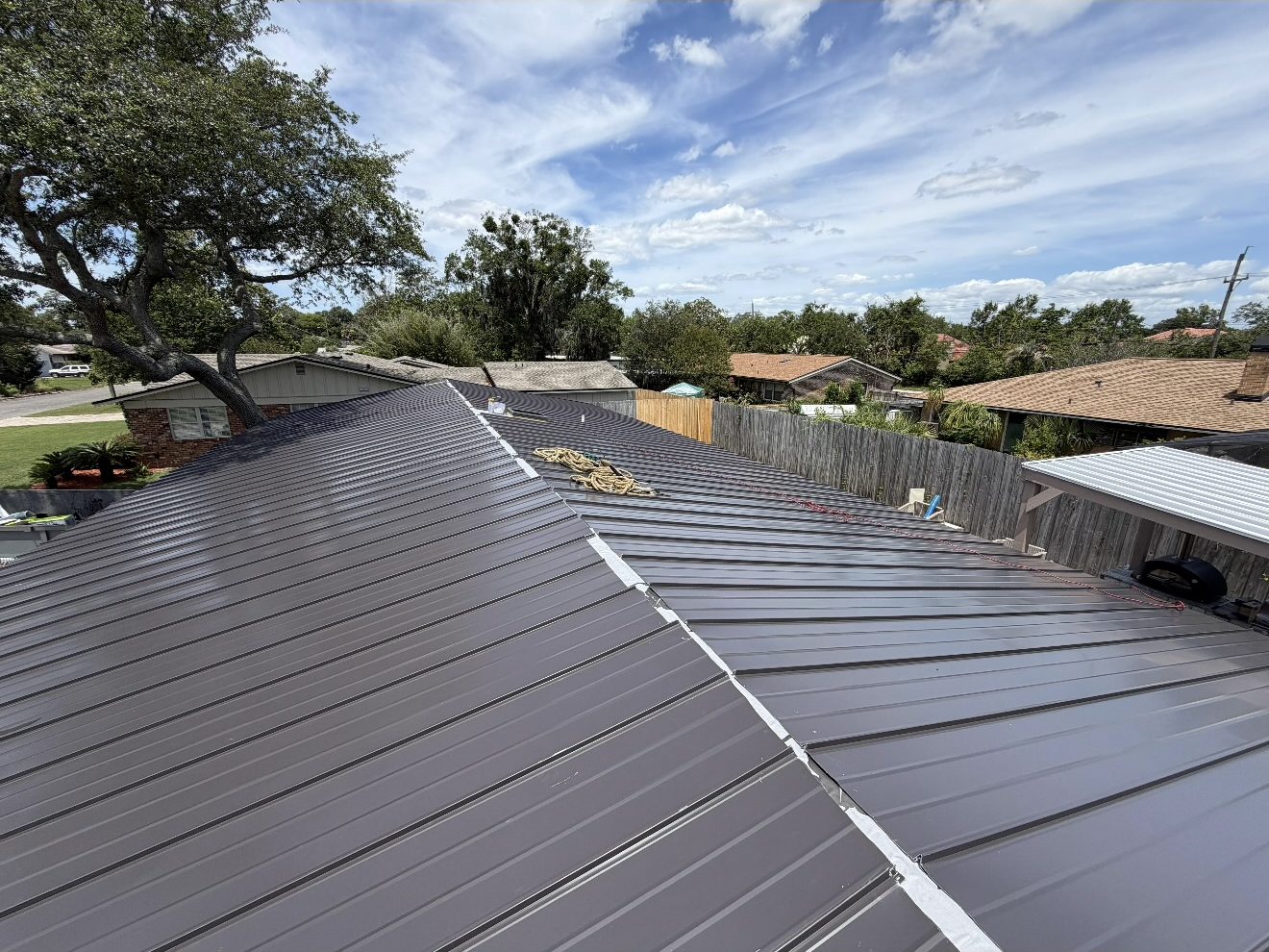 Standing seam metal roof installation by KLO Roofing on a Florida home