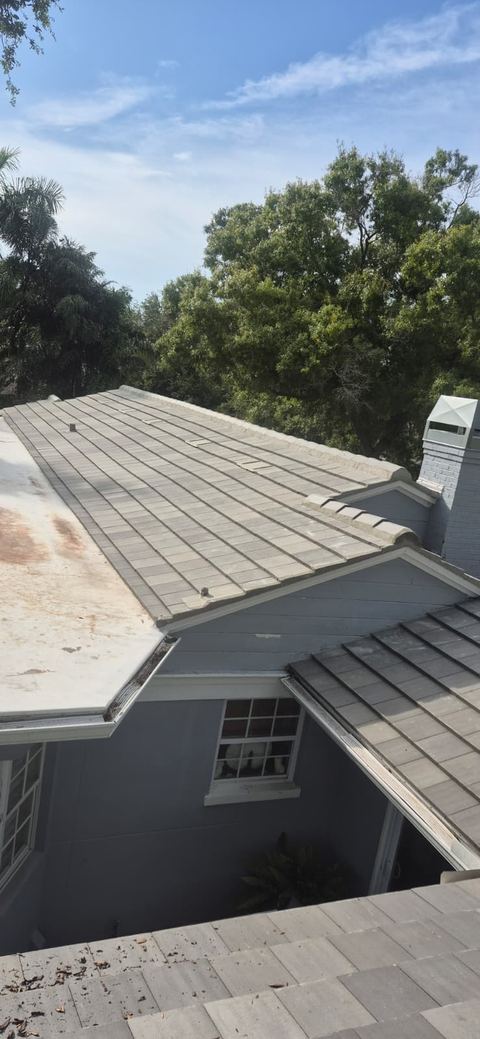 Completed flat concrete tile roof with chimney