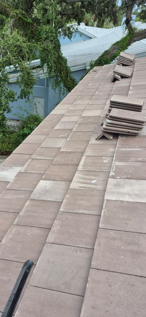 Flat concrete tile roof installation in progress